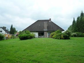 Lübeck-Moorgarten - Walmdachbungalow auf traumhaften 5.064 qm Grundstück in Waldrandlage